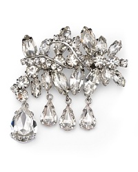 This Carolee pin is designed to celebrate the brand's 40-year history with a festive cluster of crystal stones and teardrop dangles. This Carolee pin is designed to celebrate the brand's 40-year history with a festive cluster of crystal stones and teardrop dangles.