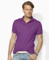 A classic short-sleeved polo shirt is cut for a relaxed, comfortable fit in smooth, soft cotton interlock.