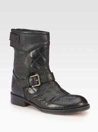 Quilted details and metal buckle straps transform this soft leather essential into an urban must-have. Stacked heel, 1¼ (30mm)Shaft, 8Leg circumference, 12Leather upperAdjustable buckle straps and exposed back zipLeather lining and solePadded insoleImported