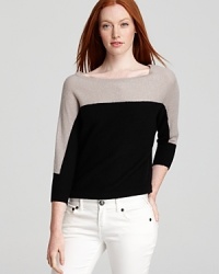 Colorblocking highlights your collarbones on this two-tone sweater from BCBGMAXAZRIA. Colorblocking highlights your collarbones on this two-tone sweater from BCBGMAXAZRIA.