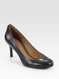 Glazed leather in a timeless silhouette with a substantial heel and round toe. Stacked heel, 2½ (65mm)Leather upperLeather lining and solePadded insoleImportedOUR FIT MODEL RECOMMENDS ordering true size. Glazed leather in a timeless silhouette with a substantial heel and round toe. Stacked heel, 2½ (65mm)Leather upperLeather lining and solePadded insoleImportedOUR FIT MODEL RECOMMENDS ordering true size.