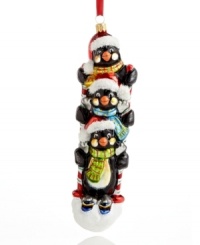 Three adventure-seeking penguins hit the slopes, sharing just two ski poles in this whimsical ornament from Kurt Adler. Featuring hand-painted Polonaise glass for extra holiday brilliance. Three adventure-seeking penguins hit the slopes, sharing just two ski poles in this whimsical ornament from Kurt Adler. Featuring hand-painted Polonaise glass for extra holiday brilliance.