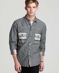 A uniquely modern take on the everyday button-down combines stripe fabric accents with neutral chambray for a stellar, innovative design. A uniquely modern take on the everyday button-down combines stripe fabric accents with neutral chambray for a stellar, innovative design.