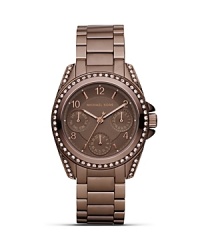 Work this season's espresso-toned watch trend with this sporty style from MICHAEL Michael Kors. Boasting a dusting of crystals, it's a subtle way to work sparkle. Work this season's espresso-toned watch trend with this sporty style from MICHAEL Michael Kors. Boasting a dusting of crystals, it's a subtle way to work sparkle.