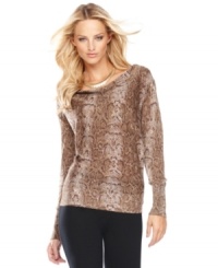 The season's favorite print, snakeskin, makes a dramatic appearance on INC's boatneck sweater. A touch of metallic shine makes this piece perfect for day-to-night dressing. (Clearance) The season's favorite print, snakeskin, makes a dramatic appearance on INC's boatneck sweater. A touch of metallic shine makes this piece perfect for day-to-night dressing. (Clearance)