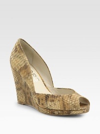 Snake-embossed metallic leather wedge with a low-cut front and subtle peep toe. Self-covered wedge, 5 (125mm)Covered platform, ½ (15mm)Compares to a 4½ heel (115mm)Snake-embossed metallic leather upperLeather liningBuffed leather solePadded insoleImported Snake-embossed metallic leather wedge with a low-cut front and subtle peep toe. Self-covered wedge, 5 (125mm)Covered platform, ½ (15mm)Compares to a 4½ heel (115mm)Snake-embossed metallic leather upperLeather liningBuffed leather solePadded insoleImported