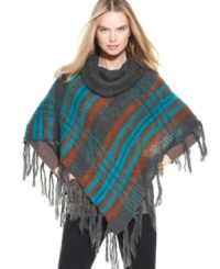 Channel your inner hippie-chic with this plaid poncho from Steve Madden that gives a nod to mod '70s accessorizing. Channel your inner hippie-chic with this plaid poncho from Steve Madden that gives a nod to mod '70s accessorizing.