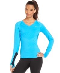 Amp up your workout in Nike's bright long-sleeve top. Thumbholes offer a snug fit, while reflective elements keep you visible, no matter where your workout takes you! Amp up your workout in Nike's bright long-sleeve top. Thumbholes offer a snug fit, while reflective elements keep you visible, no matter where your workout takes you!