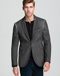 A handsome blazer with a little edge, garment dyed and washed to create faded details at the seams. And check out the guitar peg-like buttons on the cuff, drawing on rock'n'roll for inspiration. From the John Varvatos Collection. A handsome blazer with a little edge, garment dyed and washed to create faded details at the seams. And check out the guitar peg-like buttons on the cuff, drawing on rock'n'roll for inspiration. From the John Varvatos Collection.
