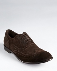 Traditional brogue detail adds classic appeal to these soft suede wingtips, adding character to your repertoire. Traditional brogue detail adds classic appeal to these soft suede wingtips, adding character to your repertoire.