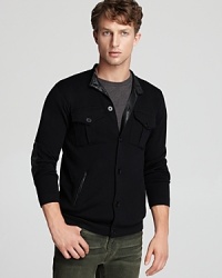 A versatile sweater with the look of a jacket provides a thoroughly modern design with leather trim details that match your downtown style. A versatile sweater with the look of a jacket provides a thoroughly modern design with leather trim details that match your downtown style.