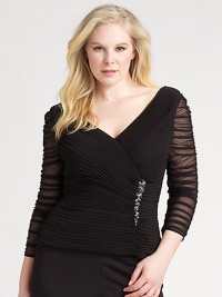 A crisply pleated bodice with flattering surplice neckline and sheer, ruched sleeves.Deep surplice neckline Jeweled embellishment at bodice Three-quarter sleeves Back zipper Fully lined bodice 93% nylon/7% spandex Dry clean Imported A crisply pleated bodice with flattering surplice neckline and sheer, ruched sleeves.Deep surplice neckline Jeweled embellishment at bodice Three-quarter sleeves Back zipper Fully lined bodice 93% nylon/7% spandex Dry clean Imported