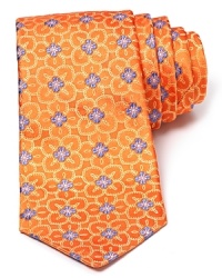 A subtle floral print takes form on luxe silk with this classic tie from Ike Behar. A subtle floral print takes form on luxe silk with this classic tie from Ike Behar.