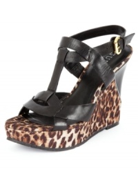 Luxe fabric give the thick straps of GUESS' Yakima wedge platform sandals a sultry feel that puts this sexy pair heads and shoulders above the rest. (Clearance) Luxe fabric give the thick straps of GUESS' Yakima wedge platform sandals a sultry feel that puts this sexy pair heads and shoulders above the rest. (Clearance)