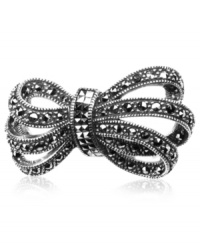 Wrapped and resplendent. Judith Jack's bow brooch, crafted from sterling silver, sparkles with marcasite (3/5 ct. t.w.). Approximate drop: 8/10 inch. Wrapped and resplendent. Judith Jack's bow brooch, crafted from sterling silver, sparkles with marcasite (3/5 ct. t.w.). Approximate drop: 8/10 inch.