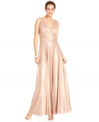 This dazzling gown from JS Collections is designed with figure-flattering details and a metallic shimmer as a finishing touch. This dazzling gown from JS Collections is designed with figure-flattering details and a metallic shimmer as a finishing touch.