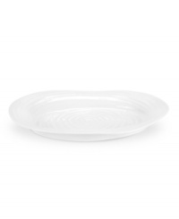 A collaboration between Portmeirion and celebrated chef Sophie Conran, this versatile platter from their collection of white dinnerware offers the charming look of hand-thrown pottery in porcelain designed for the rigors of daily use. A collaboration between Portmeirion and celebrated chef Sophie Conran, this versatile platter from their collection of white dinnerware offers the charming look of hand-thrown pottery in porcelain designed for the rigors of daily use.