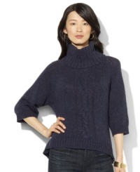 Lauren Jeans Co.'s chunky knit sweater is crafted with an oversized turtleneck and a modern high-low hem. Lauren Jeans Co.'s chunky knit sweater is crafted with an oversized turtleneck and a modern high-low hem.