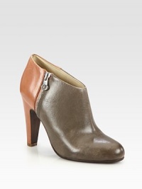Finesse your look with this silhouette of two-tone leather, featuring a sleek zipper and elevated heel for modern appeal. Self-covered heel, 4 (100mm)Leather upperSide zipperLeather liningLeather and rubber solePadded insoleImported Finesse your look with this silhouette of two-tone leather, featuring a sleek zipper and elevated heel for modern appeal. Self-covered heel, 4 (100mm)Leather upperSide zipperLeather liningLeather and rubber solePadded insoleImported