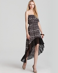 Flaunting a high low hem, Sweet Pea's lace printed maxi dress shows off its pretty pattern in classic black and white. Flaunting a high low hem, Sweet Pea's lace printed maxi dress shows off its pretty pattern in classic black and white.