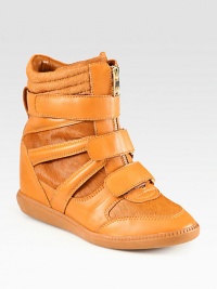 Lush calf hair adds the perfect amount of impact to this urban-inspired leather silhouette, with a hidden wedge and wide velcro straps. Hidden wedge, 3¾ (95mm)Rubber platform, ½ (15mm)Compares to a 3¼ heel (80mm)Leather and calf hair upperZip front with velcro strapsLeather liningRubber solePadded insoleImported Lush calf hair adds the perfect amount of impact to this urban-inspired leather silhouette, with a hidden wedge and wide velcro straps. Hidden wedge, 3¾ (95mm)Rubber platform, ½ (15mm)Compares to a 3¼ heel (80mm)Leather and calf hair upperZip front with velcro strapsLeather liningRubber solePadded insoleImported