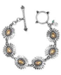 Style in full-bloom from Lucky Brand. This chic toggle bracelet includes floral charms with gold tone accents. Set in silver tone mixed metal. Approximate length: 7-5/8 inches. Style in full-bloom from Lucky Brand. This chic toggle bracelet includes floral charms with gold tone accents. Set in silver tone mixed metal. Approximate length: 7-5/8 inches.