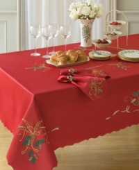 With a rich red hue and daintily scalloped edges, this oblong tablecloth puts a festive, feminine touch on wintertime tables. Swirling ribbons and sprigs of holly set the scene for delectable Christmas dining. With a rich red hue and daintily scalloped edges, this oblong tablecloth puts a festive, feminine touch on wintertime tables. Swirling ribbons and sprigs of holly set the scene for delectable Christmas dining.