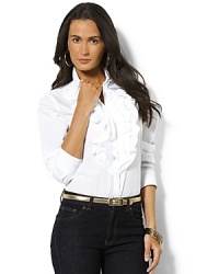 Three layers of elegant ruffles drape gently at the placket of a classic button-down shirt rendered in sophisticated cotton broadcloth. Three layers of elegant ruffles drape gently at the placket of a classic button-down shirt rendered in sophisticated cotton broadcloth.