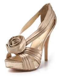An oversized rosette and glitter-encrusted platform add feminine details to Enzo Angiolini's Slendor sandals. An oversized rosette and glitter-encrusted platform add feminine details to Enzo Angiolini's Slendor sandals.