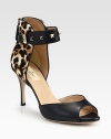 Signature metal studs decorate the ankle strap of this leather design, elevated by a sky-high heel. Self-covered heel, 3½ (90mm)Leather upper with metal studsAdjustable ankle strap and back zipLeather lining and solePadded insoleMade in Italy