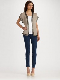A light layer of luxe, edged in dazzling beaded braid.V-neck Hidden front closures Seamed peplum waist Dolman cap sleeves About 23 long Silk; dry clean Imported A light layer of luxe, edged in dazzling beaded braid.V-neck Hidden front closures Seamed peplum waist Dolman cap sleeves About 23 long Silk; dry clean Imported