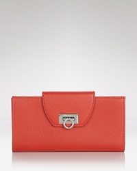 When organization is front of mind, this Salvatore Ferragamo totally fits the bill, detailed by a flip-lock closure which opens to an interior with with 13 card slots and a zip pocket. When organization is front of mind, this Salvatore Ferragamo totally fits the bill, detailed by a flip-lock closure which opens to an interior with with 13 card slots and a zip pocket.