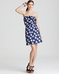 A generous swirl of sparkle illuminates a constellation of star-burst print for a Lilly Pulitzer dress as dazzling as the summer's night sky. A generous swirl of sparkle illuminates a constellation of star-burst print for a Lilly Pulitzer dress as dazzling as the summer's night sky.