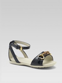 Classic patent leather sandals with ankle strap closure and bamboo horsebit detail.Ankle strap with buckle closurePatent leather upperLeather liningRubber solePadded insoleMade in Italy Classic patent leather sandals with ankle strap closure and bamboo horsebit detail.Ankle strap with buckle closurePatent leather upperLeather liningRubber solePadded insoleMade in Italy