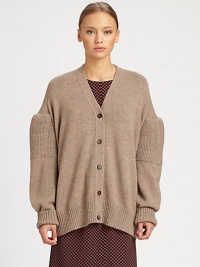 A slouchy dropped-shoulder silhouette elevates the classic cardigan.V necklineDropped shoulderButton frontLong puffed sleevesRib-knit cuffs and hemAbout 26 from shoulder to hemAlpacaDry cleanMade in Italy of imported fabricModel shown is 5'8 (172cm) wearing US size Small. A slouchy dropped-shoulder silhouette elevates the classic cardigan.V necklineDropped shoulderButton frontLong puffed sleevesRib-knit cuffs and hemAbout 26 from shoulder to hemAlpacaDry cleanMade in Italy of imported fabricModel shown is 5'8 (172cm) wearing US size Small.