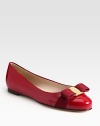 Glossy patent leather classic is a favorite with signature grosgrain bow at the toe. Grosgrain bow and logo hardware at toe Leather lining and sole Made in ItalyOUR FIT MODEL RECOMMENDS ordering true size.