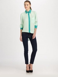 Dreamy silk chiffon elevates this tailored button-down finished with supple satin trim.Point collarButton-down placketChest pocketLong sleeves with button cuffsHem is longer in backAbout 31 from shoulder to hemSilkDry cleanMade in USAModel shown is 5'10 (177cm) wearing US size Small. Dreamy silk chiffon elevates this tailored button-down finished with supple satin trim.Point collarButton-down placketChest pocketLong sleeves with button cuffsHem is longer in backAbout 31 from shoulder to hemSilkDry cleanMade in USAModel shown is 5'10 (177cm) wearing US size Small.