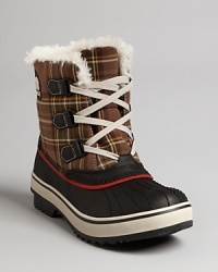 Sorel goes mad for retro, '50s style plaid in these stylish and functional waterproof booties. Faux fur linings make them plushly warm while rubber bottoms keep the damp out. Sorel goes mad for retro, '50s style plaid in these stylish and functional waterproof booties. Faux fur linings make them plushly warm while rubber bottoms keep the damp out.