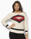 A soft knit sweater is crafted with a Southwestern-inspired pattern at the front and rustic buttons at the shoulder.