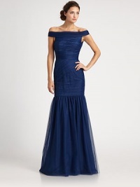 This romantic design features an alluring off-the-shoulder neckline and a full trumpet skirt.Off-the-shoulder necklineAllover ruchingTrumpet skirtLow back with concealed zipFully linedAbout 46 from natural waistNylonDry cleanImportedModel shown is 5'11 (180cm) wearing US size 4. This romantic design features an alluring off-the-shoulder neckline and a full trumpet skirt.Off-the-shoulder necklineAllover ruchingTrumpet skirtLow back with concealed zipFully linedAbout 46 from natural waistNylonDry cleanImportedModel shown is 5'11 (180cm) wearing US size 4.