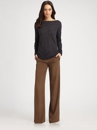 Lengthy, on-trend boatneck has dropped shoulders, long dolman sleeves and a classic stripe print. BoatneckDropped shouldersLong dolman sleevesLonger length hits below the hips70% viscose/30% woolDry cleanImportedModel shown is 5'10 (177cm) wearing US size Small. Lengthy, on-trend boatneck has dropped shoulders, long dolman sleeves and a classic stripe print. BoatneckDropped shouldersLong dolman sleevesLonger length hits below the hips70% viscose/30% woolDry cleanImportedModel shown is 5'10 (177cm) wearing US size Small.