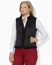 A luxurious quilted vest reverses to a plush faux-shearling side, doubling the glamorous wardrobe-styling options for the modern woman. A luxurious quilted vest reverses to a plush faux-shearling side, doubling the glamorous wardrobe-styling options for the modern woman.