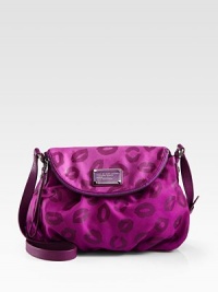 Playful lips cover this slouchy leather bag topped with a signature logo plaque. Adjustable shoulder strap, 18-21 dropMagnetic flap and top zip closureOne inside zip pocketTwo inside open pocketsFully lined13W X 11H X 3½DImported Playful lips cover this slouchy leather bag topped with a signature logo plaque. Adjustable shoulder strap, 18-21 dropMagnetic flap and top zip closureOne inside zip pocketTwo inside open pocketsFully lined13W X 11H X 3½DImported