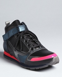 Sneaker collector or fashionista-on-the-go, you'll love Jill Sander's futuristic take on the high top sneaker, accented with metallic and neon coral touches. Sneaker collector or fashionista-on-the-go, you'll love Jill Sander's futuristic take on the high top sneaker, accented with metallic and neon coral touches.