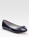 Patent leather staple with grosgrain trim and a delicate bow. Patent leather upperLeather lining and solePadded insoleImported