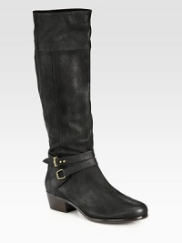 Rich pebble-grain leather forms this tall silhouette, topped with equestrian-inspired hardware. Stacked heel, 1¾ (45mm)Shaft, 16½Leg circumference, 15½Leather upperSide zipAnkle strap with adjustable metal pull-tabsLeather lining and solePadded insoleImported Rich pebble-grain leather forms this tall silhouette, topped with equestrian-inspired hardware. Stacked heel, 1¾ (45mm)Shaft, 16½Leg circumference, 15½Leather upperSide zipAnkle strap with adjustable metal pull-tabsLeather lining and solePadded insoleImported