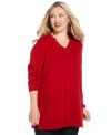 Dress up your casual style with Debbie Morgan's plus size tunic sweater, finished by a sequined neckline.