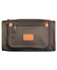 Your get-up-and-go go-to! Slim and convenient, this travel kit stores all of your hygienic must-haves in an easy-access water-resistant interior and slips quickly into the U-zip pockets on many Tumi bags, keeping your travel lifesavers always within reach. 5-year warranty. Your get-up-and-go go-to! Slim and convenient, this travel kit stores all of your hygienic must-haves in an easy-access water-resistant interior and slips quickly into the U-zip pockets on many Tumi bags, keeping your travel lifesavers always within reach. 5-year warranty.