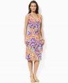 Smooth paisley jersey flatters the body in a feminine petite A-line silhouette with an elegant cross-wrap neckline, from Lauren by Ralph Lauren. (Clearance)