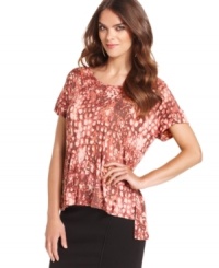 In an abstract python-print, this Kensie top adds a splash of style to your look with it's high-low hem! In an abstract python-print, this Kensie top adds a splash of style to your look with it's high-low hem!